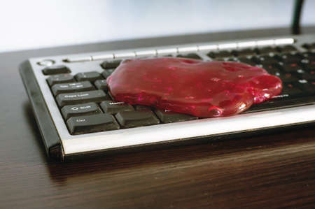Slime is the ultimate tool to clean the keyboard from dust and dirtの写真素材