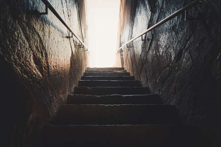 Old abandoned stairs going up to the light. Hope conceptの写真素材