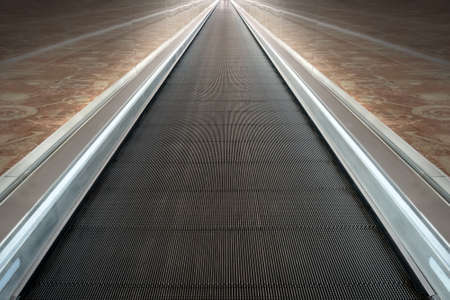 escalator of modern office building, blue toned images. concept of the movement path.