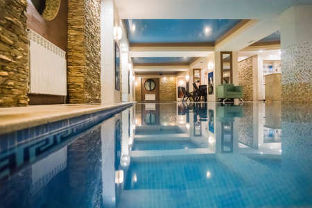 Small swimming pool in the bathroom, sauna or sanatorium. Swimming pool with blue clear transparent waterの写真素材