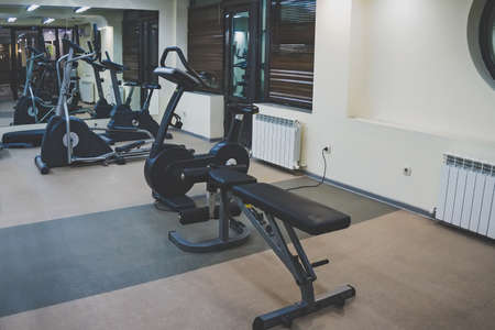 Interior of a fitness hall. Various gyms for sports in a small home gym.の写真素材