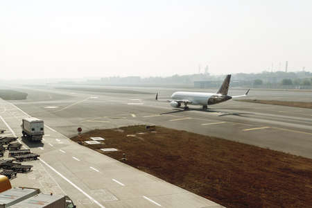 Airport with airplane. Airfield universal cleaning machine, pushback tug,の写真素材