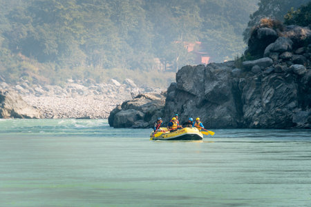 Young persons rafting on the Ganges river in Rishikesh, extreme and fun sport at tourist attraction. Rishikesh India.のeditorial素材