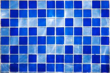 Square pattern of blue and light blue tiles for bath walls and floor design or swimming pool design....