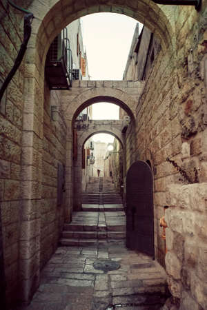 Mystical street at morning in the old city of Jerusalem. Old narrow streets in the quarter of Jerusalem.の写真素材