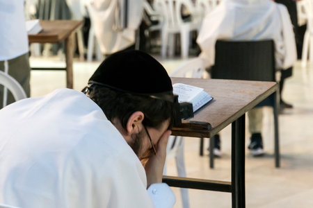 Religious orthodox jew praying at the Western wall in Jerusalem old city. JERUSALEM, ISRAEL. 24...
