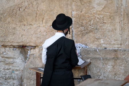 Religious orthodox jew praying at the Western wall in Jerusalem old city. JERUSALEM, ISRAEL. 24...