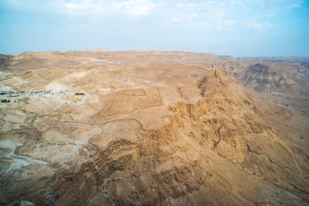 view of canyon from top of the Masada National Park, the ruins of the palace of King Herod's Masada in the Dead Sea region of Israel. Ancient Roman site for the siege of the fortress. Midbar Yehudaの写真素材