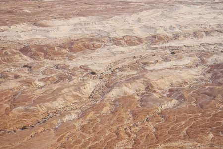 Top view from Masada fortress to the Judaean desert and the Dead Sea. The desert land of Israel. Background of canyon in the desert. Desert in which 40 years Moses was looking for the promised landの写真素材