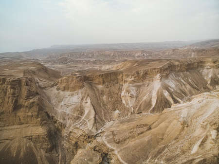 Canyon in the Judean Desert , Midbar Yehuda, on the dead sea, Israel. Background of lifeless land in the desert on the West Bank of the Jordan riverの写真素材
