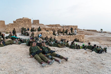 Masada, Israel. 23 October 2018: Group soldiers of the Infantry of the Israeli Army on maneuvers in the fortress of Masada to relax after a long March-throw on the mountain.のeditorial素材