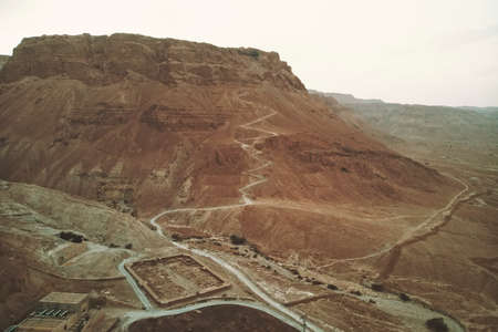 aerial view of the ruins of roman camp at the masada fortress in the arava valley in israel. Historical ruins. Archaeological excavations in the desert.の写真素材