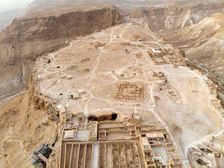 Masada fortress area Southern District of Israel Dead Sea area Southern District of Israel. Ancient Jewish fortress of the Roman Empire on top of a rock in the Judean desert. front view from the airの写真素材