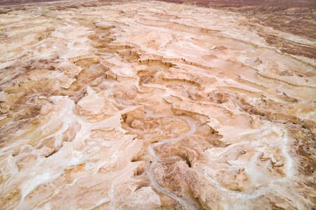 Top view from Masada fortress to the Judaean desert and the Dead Sea. The desert land of Israel. Background of canyon in the desert. Desert in which 40 years Moses was looking for the promised landの写真素材