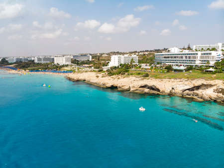 Cyprus beautiful coastline, Mediterranean sea of turquoise color. Houses on the Mediterranean coast. Tourist town with a beach. Summer vacation at sea. Cyprus, Ayia NAPAの写真素材
