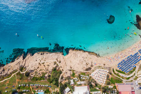Cyprus beautiful coastline, Mediterranean sea of turquoise color. Houses on the Mediterranean coast. Tourist town with a Long beach. Summer vacation at sea. top view, aerial view.の写真素材