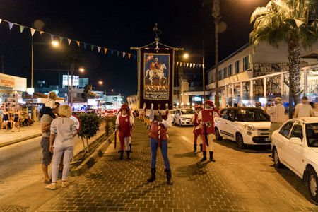 Annual festival of Medieval cultures of Europe. The procession of the column in the carnival historical costumes of the city at night. Cyprus, Ayia NAPA. 19 October 2018のeditorial素材