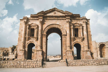 Arch of Hadrian in the ancient Jordanian city of Gerasa, preset-day Jerash, Jordan. It is located about 48 km north of Amman. ancient Roman city of Jerash is one of the main attractions of Jordanの写真素材