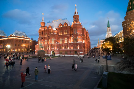 The State Historical Museum at Red Square in Moscow, Russia. People walk in the evening on the square in front of the Museum. Moscow. 28 October 2018.のeditorial素材