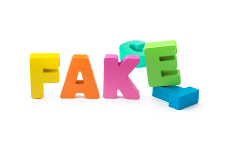 Fact or Fake concept, 3D letters on white isolated background. fake substitute for factの写真素材