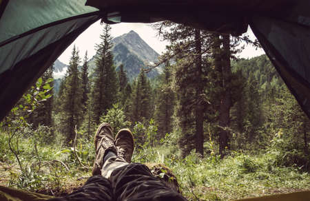 View from a tent in the mountains. Travel concept.の写真素材