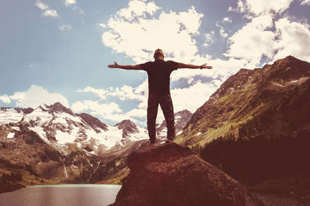 Freedom. Free man with open arms on sunset. success. Travel. Good life. Backpacker, Hiking the conquest of mountain climbing.の写真素材