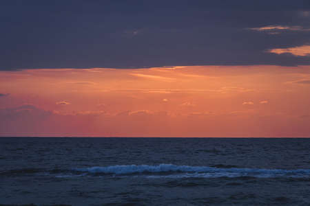 Sea at Huahin. horizon line of the sea. tinted retro photo. Beautiful cloudy sky at dawn. Three lines of different colors created by nature. calm the sea after a stormの写真素材