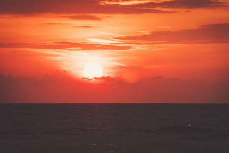 background of beach sunrise and sea waves, vintage filter. morning dawn at the sea in the Indian oceanの写真素材