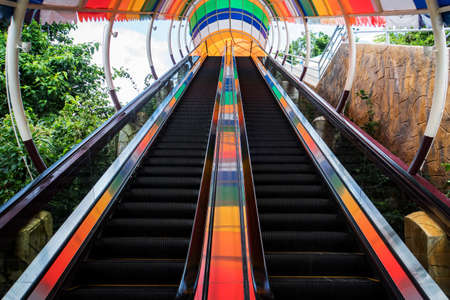 Long escalator for ascent to the second floor. Step up the escalator staircase.の写真素材