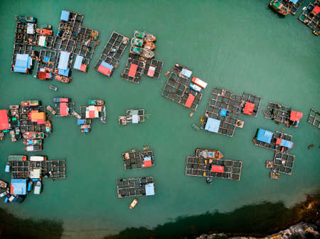 a floating fisherman's village in ha long bay, northern vietnam. top view, aerial view,の写真素材