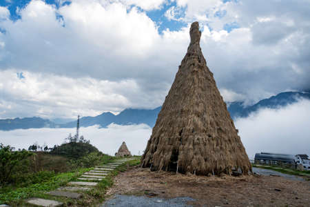 Traditional home of small peoples of North Vietnam, living in the mountains near the city of Sapa. Historical reconstruction. Installation. Ancient straw dwelling tribes in Southeast Asia.の写真素材