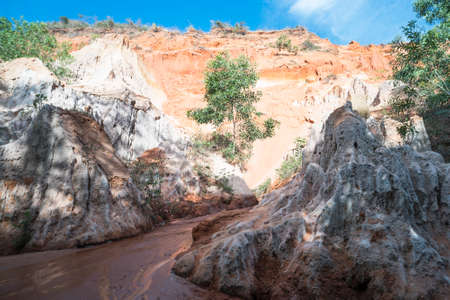 Fairy Stream Canyon, Mui Ne, Vietnam, Southeast Asia. Beautiful scenic landscape with red river, sand dunes and jungle. Tropical oasis scenery. Popular, famous landmark, tourist destination Vietnam.の写真素材