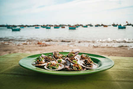 Grilled clamshell - a famous seafood in Vietnam. MUI ne, Vietnam a village of fishermenの写真素材