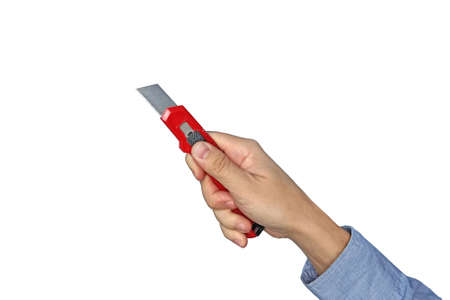 Male hands holding red sharp box cutter. Isolated on white background. Closeup.の写真素材