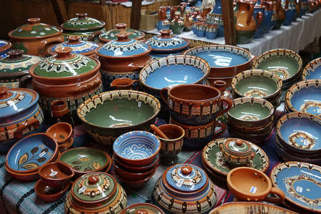 Many decorative dishes on the counter at the medieval festival in Cyprus. Ayia NAPA.の写真素材