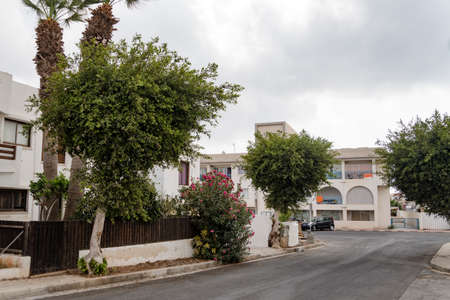 Clean tidy city street of the European city. Beautiful city streets of Ayia NAPA, Cyprus. Mediterranean city in summer in daylight.の写真素材