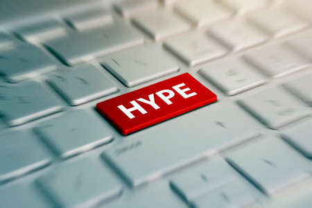 HYPE - red Button on grey Computer Keyboard. blurred in motion background.の写真素材