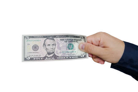 Hand with five dollar bill, isolated on white backgroundの写真素材