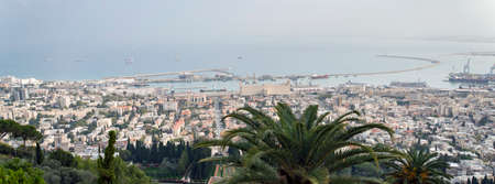 View of Haifa from the Bahai garden shot on a fine day. Panoramuic scenic view of Haifa harbour, third largest city of Israel. Majestic picture of middle easten city port shot from height.の写真素材