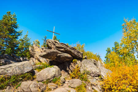 Cross at the top of the cliff on Mount Tserkovka resort Belokurikha in the Altai Kraiの写真素材