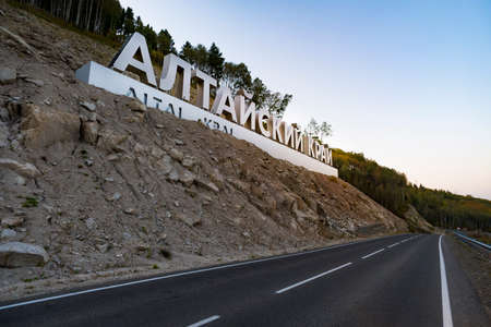 Inscription in Russian language Altai Krai is the name of a region in Western Siberia in Russia. Letters on a rock near the serpentine road. tourist cluster Belokurikha 2の写真素材