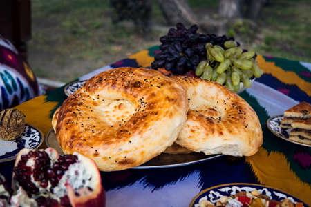 Uzbek restaurant bread. freshly baked tortilla on a traditional tableの写真素材