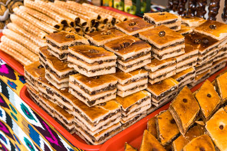 Baklava. Traditional Turkish sweets. Oriental flavors. market with Oriental sweets. Food on the counterの写真素材