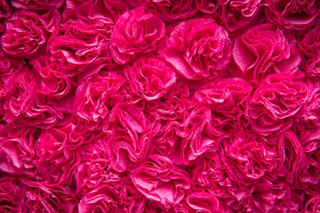 unnatural artificial flowers. red rose background , textureの写真素材