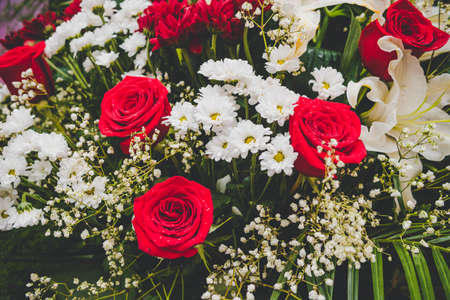 Large Beautiful bouquet of mixed flowers. Floral shop concept . Beautiful fresh cut bouquet. Flowers delivery. red e roses in a bouquetの写真素材