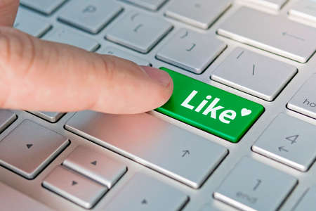 inscription like on the button on the gray keyboard. Expression of respect for the content on the web site.の写真素材