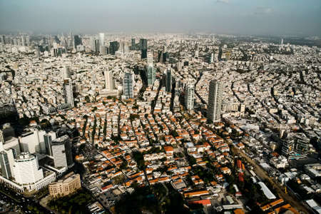 Aerial view of City of Tel Aviv, Israel. Densely populated territory of second large israeli city. Roof view of populous city, skyscrapers, modern buildings of Tel Aviv. Travellingの写真素材