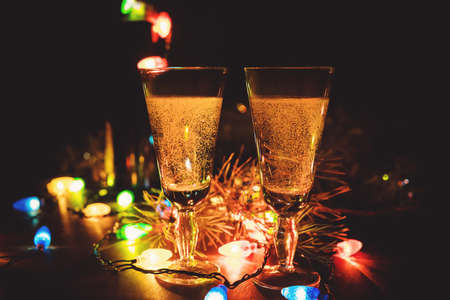 Two champagne glasses and Christmas ornamentsの写真素材