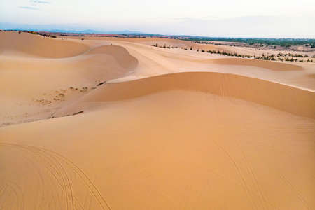 Before sunset with rainbow at Sand dunes in Bau Trang- Mui Ne- Binh Thuan Province Vietnam. Bau Trang is a famous landscape near Mui Ne Beach. It is located amid endless sand hillsの写真素材