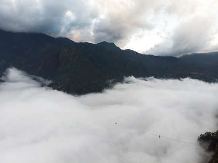 cable car to Fansipan mountain with a green valley landscape on the background. Sapa Vietnam....